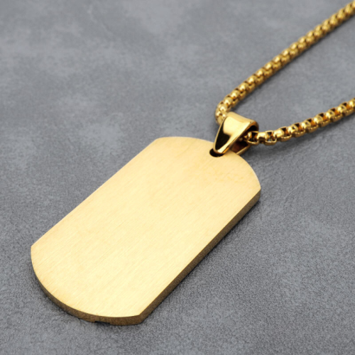 Atrás suave del colgante militar de acero dorado, la superficie ideal lista para acomodar el grabado a medida.