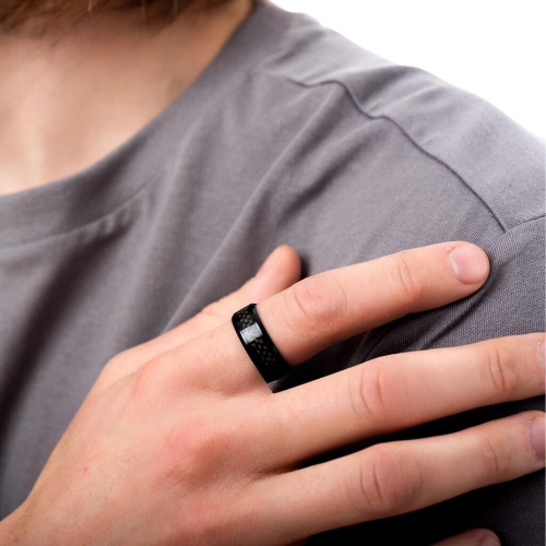 Black steel racy and carbon fiber raised by a man with a modern and trendy style.