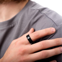 Black steel racy and carbon fiber raised by a man with a modern and trendy style.