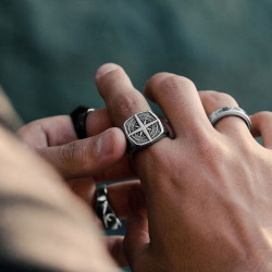 Modern and wide stainless steel man ring with a relief compass in a square setting 2