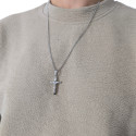 Man wearing a necklace with crucifix cross pendant in silvery stainless steel on its Cuban chain of 60 cm