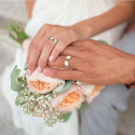Steel and gold engagement ring end with the annular of a couple to symbolize their commitment promise