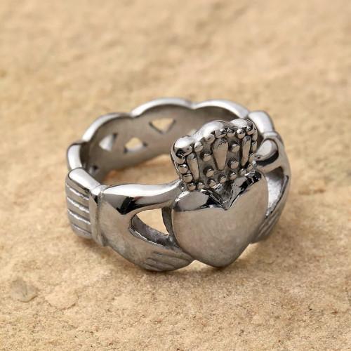 Detailed view of the ring showing the finely carved Celtic nodes on the sides of the steel claddagh ring