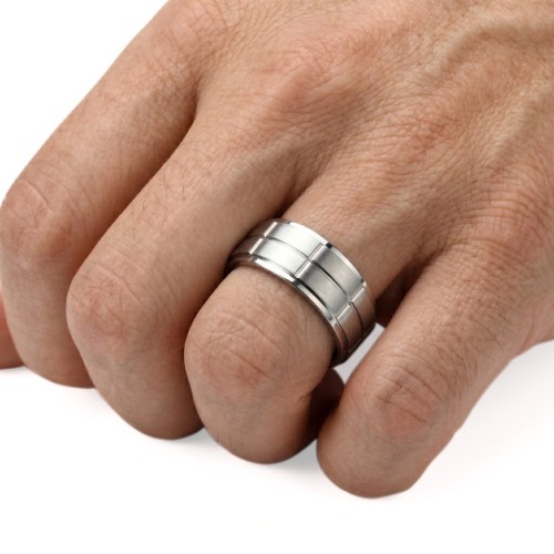 Engaged titanium man engagement ring with embossed ring to engrave