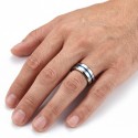 Silver polished tungsten carbide ring adorned with an ionized vibrating blue band