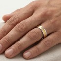 Another angle of the steel and gold alliance raised by a man illustrating the precious shine of his stone in zirconium oxide