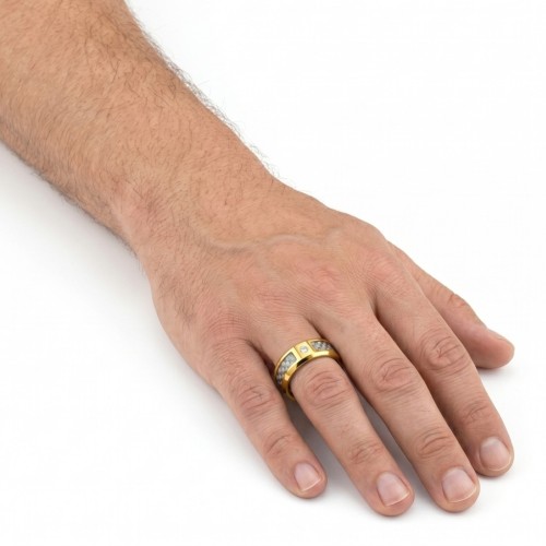 Other angle of the golden steel ring worn by a man illustrating his relief of his silver carbon fiber tape