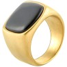 Modern and wide knurry ring for men in golden steel with rectangular face set with a black Onyx stone