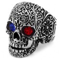 Modern and wide biker ring for man in steel with death head with tribal patterns and red and blue eyes