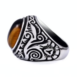 Modern and wide knight for man in silvery stainless steel decorated with a natural stone of tiger with golden highlights