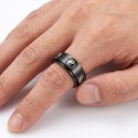 View of a man wearing this anti-stress ring with Yin Yang pattern showing that the ring is rotating on itself