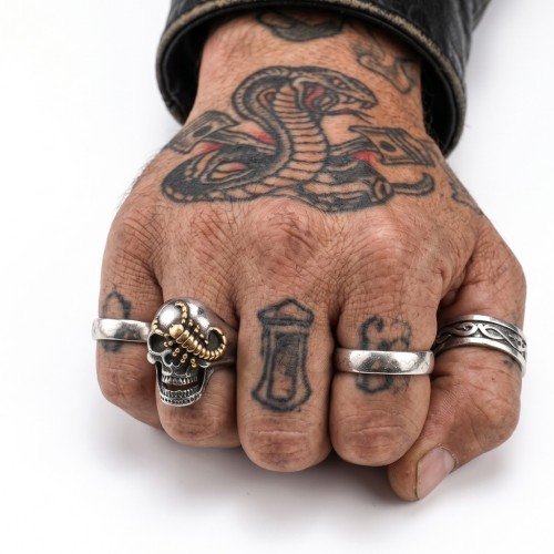Knight head of death with gold scorpion run by a man to display a biker style, hard-rock and rebellious