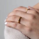 Golden hexagonal ring engraved I love you by a woman for a declaration of romantic and elegant love