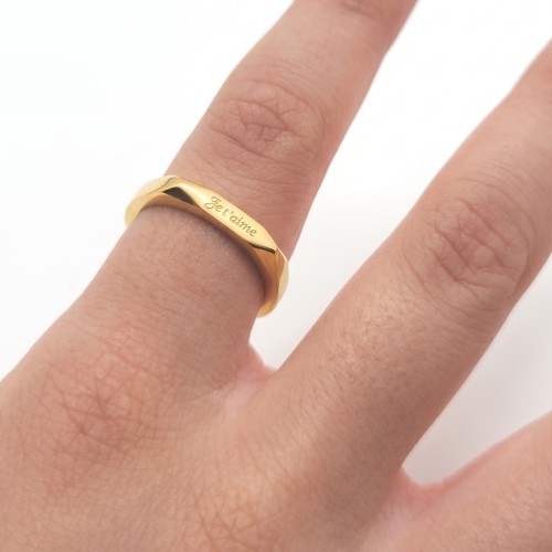 Ring I love you hexagonal gold steel worn by a woman for a declaration of love or valentine's day