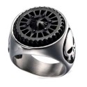 Close up on the beautiful finishes of the Punisher death head and the rotating gear teeth of the steel ring.