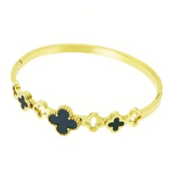 Woman's rod bracelet with golden steel, highlighting the alternation of black and conceived clover patterns.