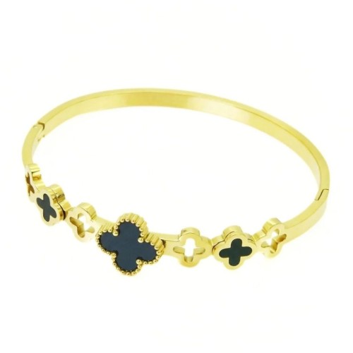 Woman's rod bracelet with golden steel, highlighting the alternation of black and conceived clover patterns.