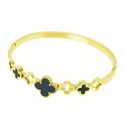 Woman's rod bracelet with golden steel, highlighting the alternation of black and conceived clover patterns.