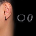 Thin black plated steel hoop domed hoop earrings worn by a man