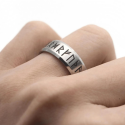 Another angle of the runic ring reaching finger illustrating its key presence and timeless design on a daily basis