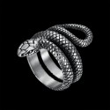 Close-up of the ring showing the accuracy of the relief of the reptile scales contrasting with the brilliance of polished steel