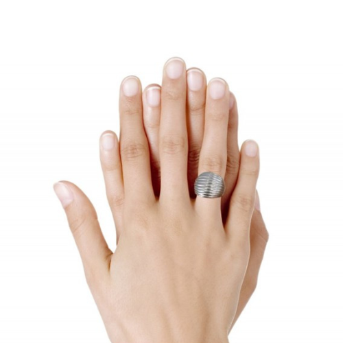 Large stainless steel shell domed ring worn by a woman