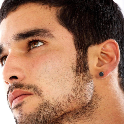 Pair earrings steel diams zircon round black worn by a man