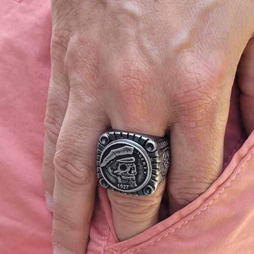 Huge liberty 1927 skull biker steel signet ring worn by a man