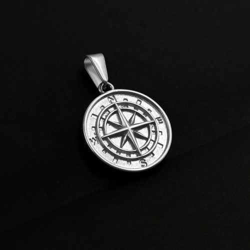 Steel compass pendant necklace worn with Cuban chain included on a black background