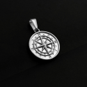 Steel compass pendant necklace worn with Cuban chain included on a black background