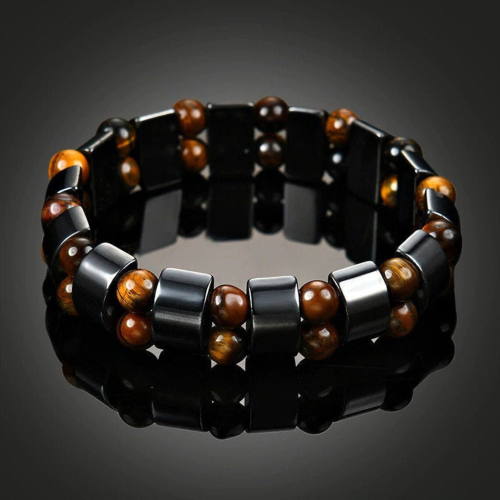 Men's bracelet with tiger's eye bead and spiritual magnetic black hematite on a black background