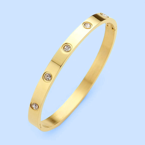 Bangle cuff bracelet for women in gold-colored steel set with zirconiums