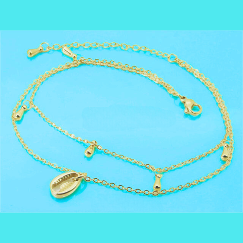 Pulsera de cadena tobillera para mujer, de acero dorado con finos granos de café dorados, fondo azul