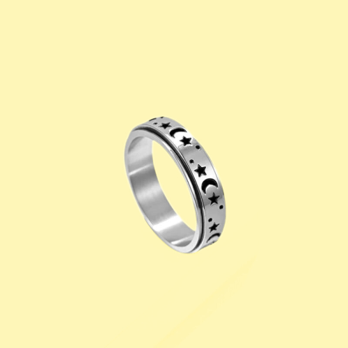 Anillo anillo niño niña mujer acero giratorio antiestrés luna estrella fondo amarillo