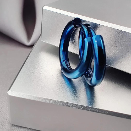 Fine women's men's steel blue color curved creole earrings presented