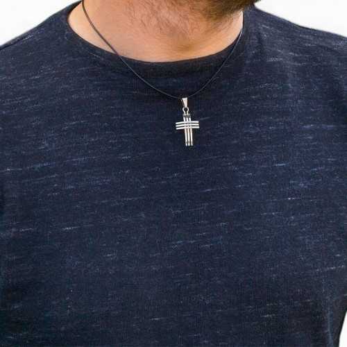 Men's triple cross pendant in stainless steel worn by a man