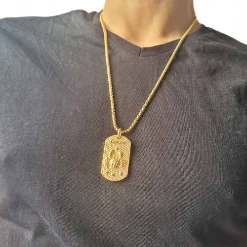Golden steel gold plate pendant necklace astrological sign cancer worn by a man