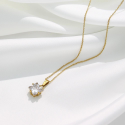 Necklace for golden steel woman posed on a white silk, highlighting its lonely zirconium squared pendant.